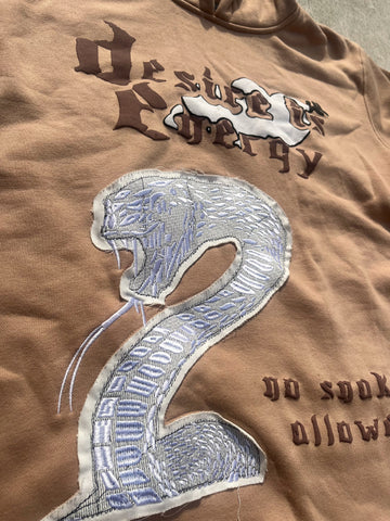 “No Snakes Allowed” - Creme Cropped Hoodie